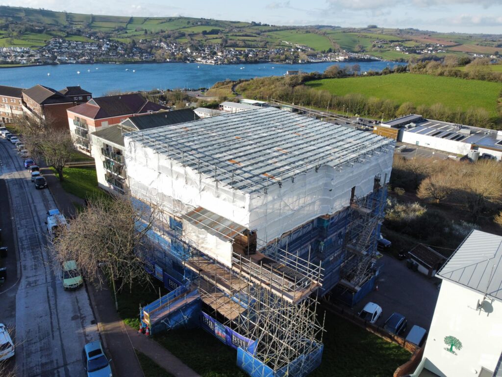 Failed Cavity Wall Insulation Extraction South West Specialists Photo of Teign Housing Flats Aerial View Showing scaffolding cover